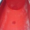 A close-up shot of the giant red vibratory tub